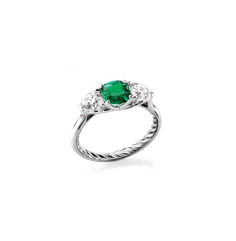 David Yurman Classic three stone engagement ring in platinum set with an emerald and two diamonds.